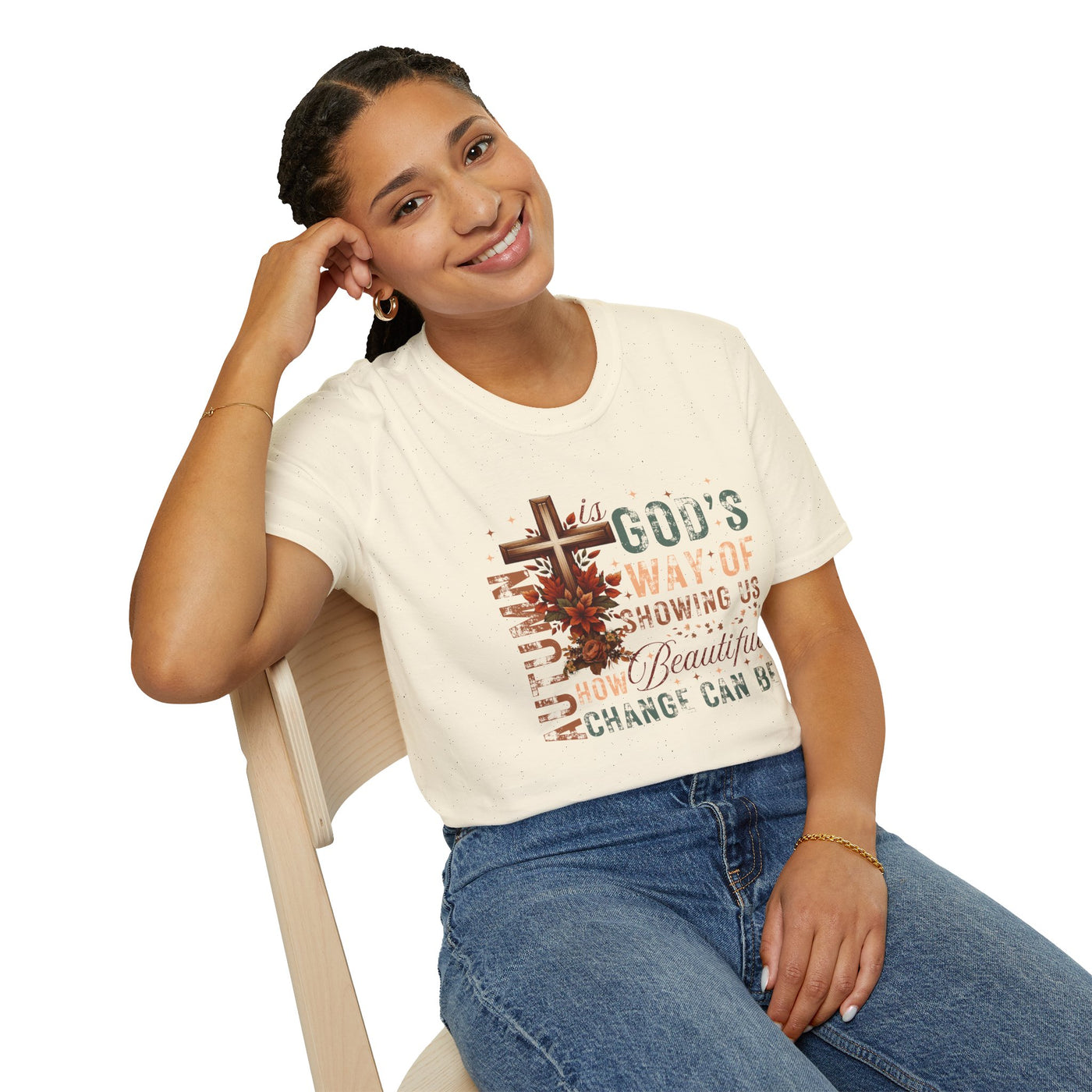 Smiling woman wearing a fall-inspired tee with a faith message about change and autumn beauty.