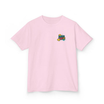Pink kids tee featuring 'Dream Big. Show Up. Repeat.' motivational design, perfect for back-to-school inspiration.
