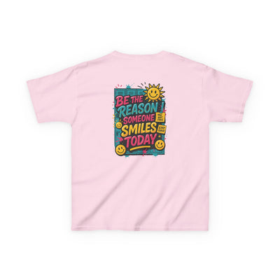 Kids' pink t-shirt with motivational message 'Be The Reason Someone Smiles Today' and cheerful sun design.