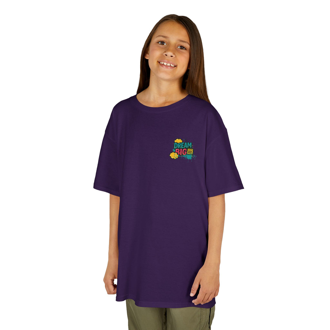 Motivational back-to-school kids tee in purple featuring 'Dream Big. Show Up. Repeat.' design.