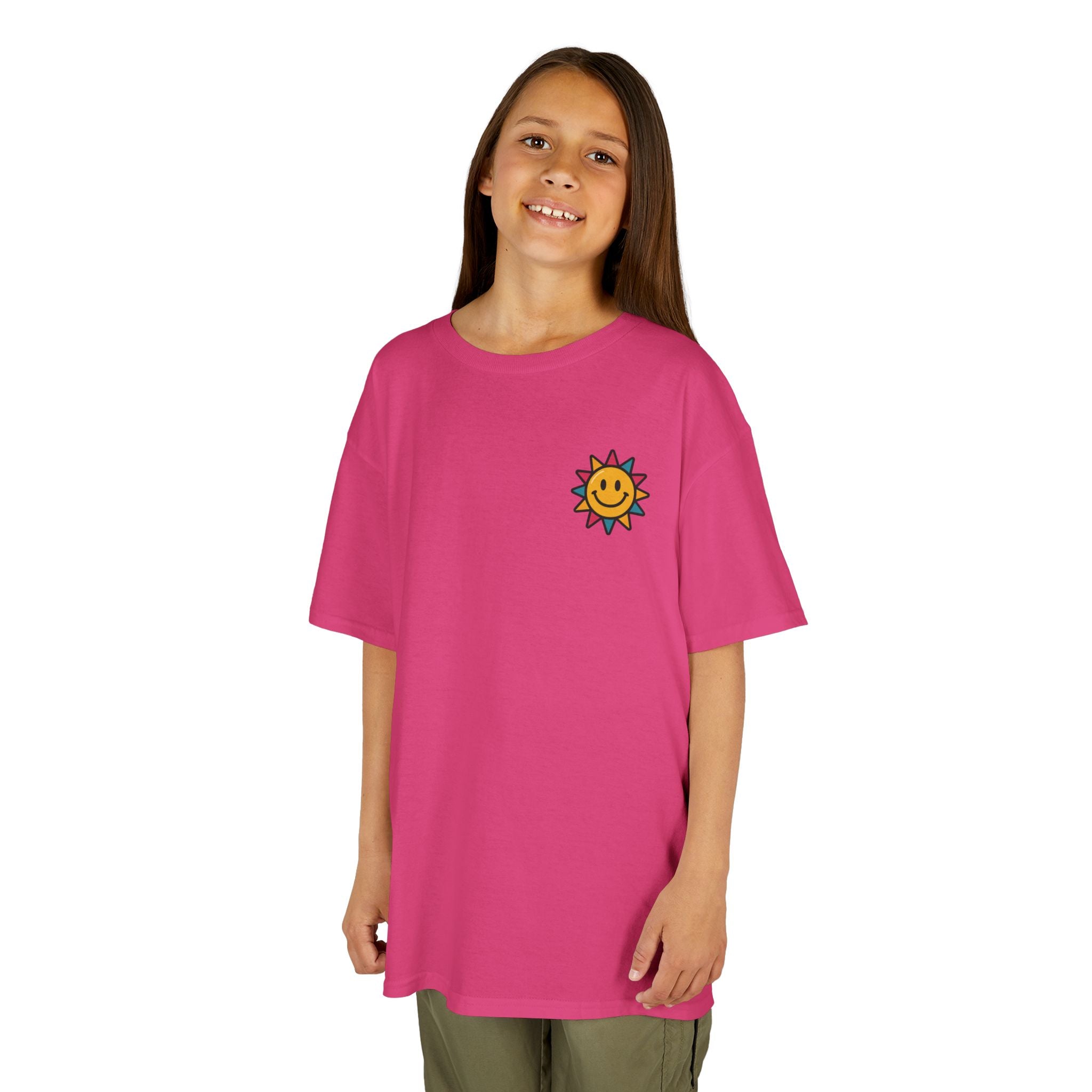 Kids pink motivational t-shirt featuring a cheerful sun graphic, perfect for spreading positivity and smiles.