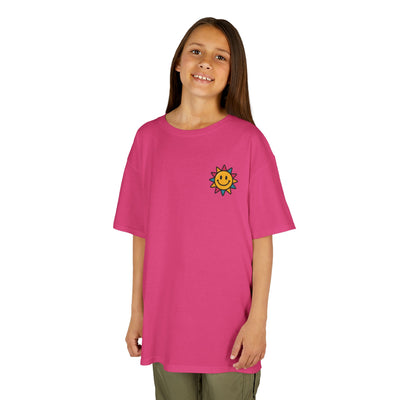 Kids pink motivational t-shirt featuring a cheerful sun graphic, perfect for spreading positivity and smiles.