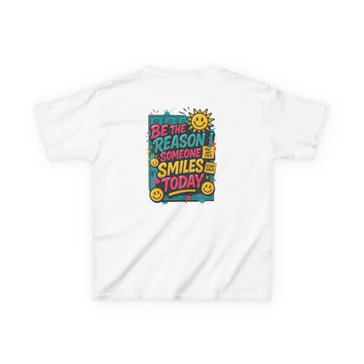 Back view of white kids' t-shirt featuring a colorful 'Be The Reason Someone Smiles Today' graphic with cheerful sun and smiley faces.