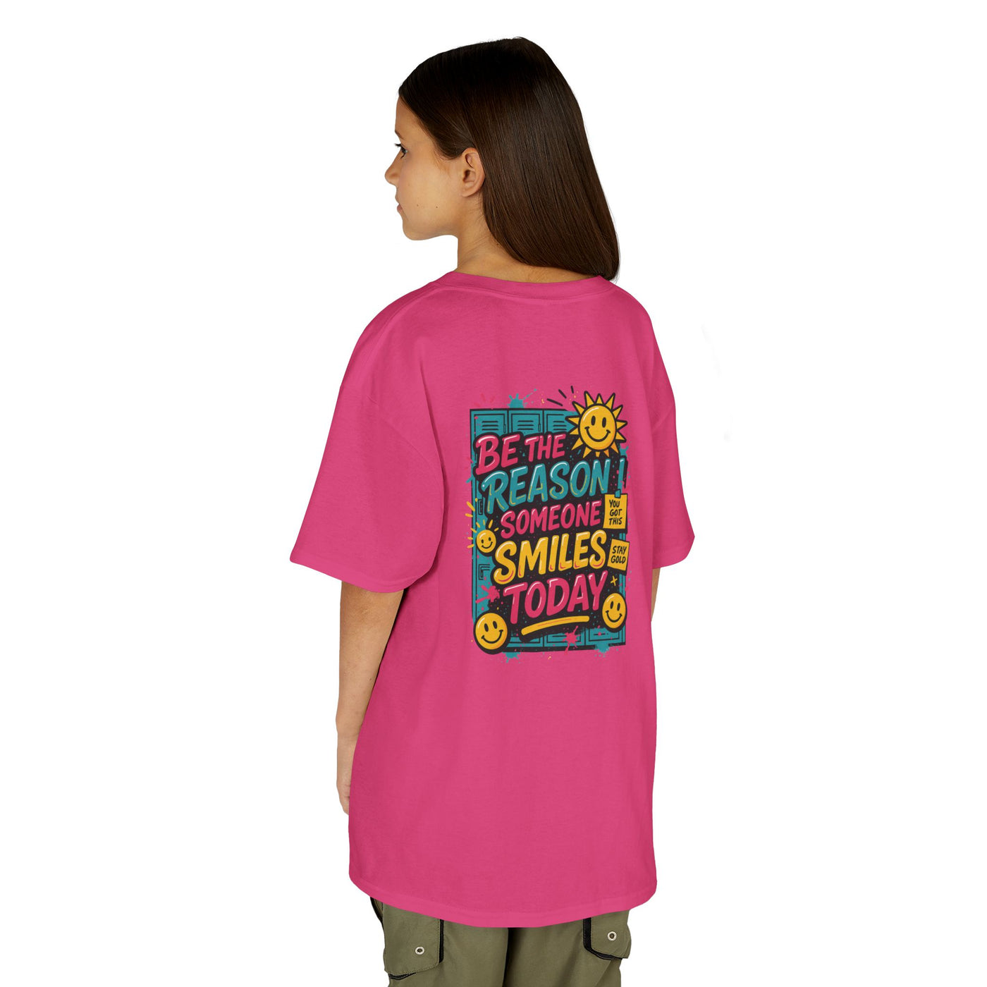 Kids' back view of pink Be The Reason Someone Smiles Today motivational tee with cheerful sun graphic.
