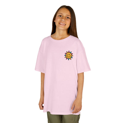Kids motivational back-to-school tee with cheerful sun graphic in soft pink color.