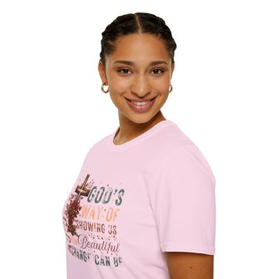 Smiling woman in a pink tee that reads 'Autumn Is God's Way of Showing Us How Beautiful Change Can Be' in fall colors.