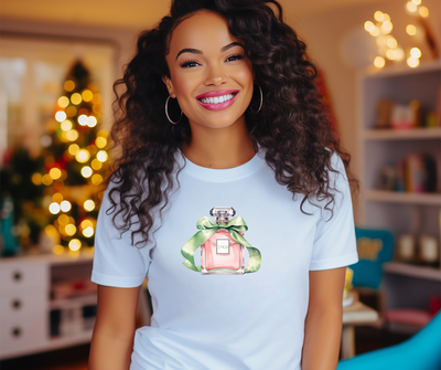 Woman wearing a white t-shirt with a graphic design, sitting in a cozy room with festive decorations.