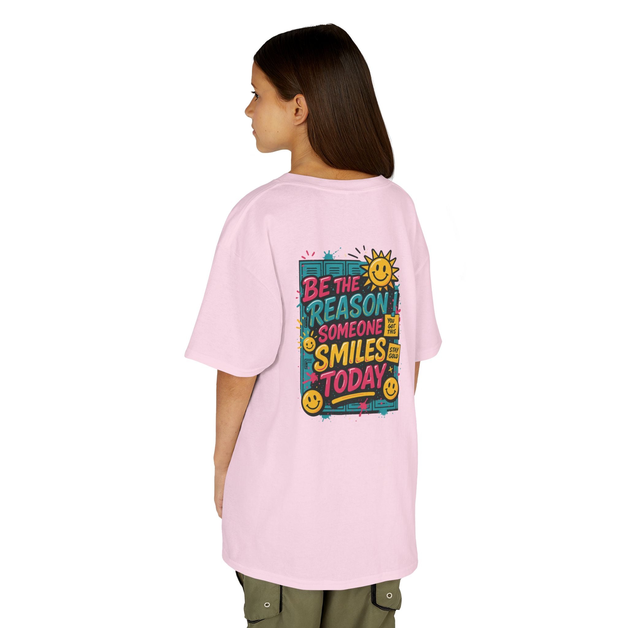 Kids pink t-shirt with 'Be The Reason Someone Smiles Today' graphic, perfect for back-to-school motivation.