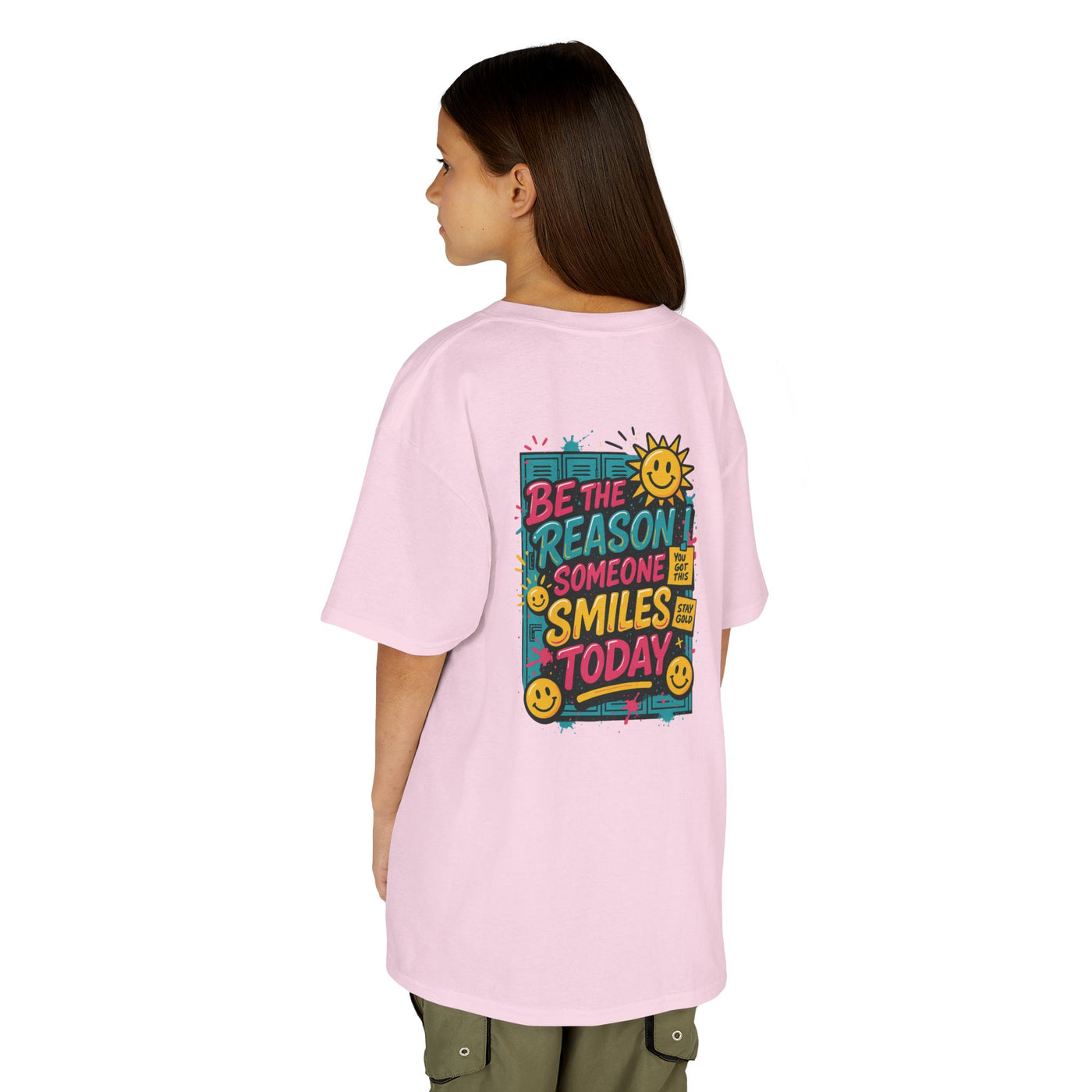 Kids pink t-shirt with 'Be The Reason Someone Smiles Today' graphic, perfect for back-to-school motivation.