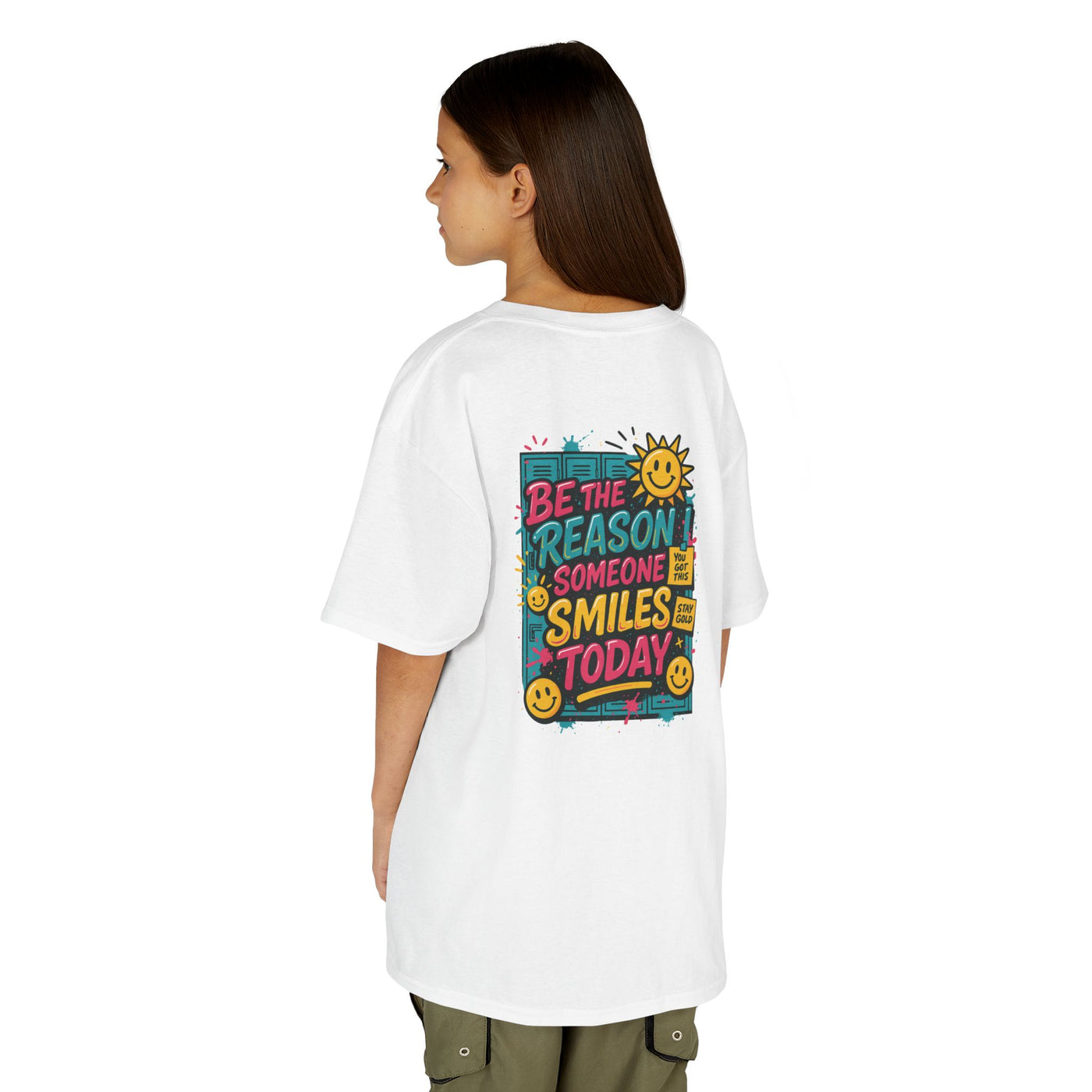 Kids motivational back-to-school tee with cheerful sun graphic and "Be The Reason Someone Smiles Today" text on back.