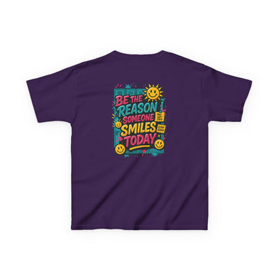 Kids motivational back-to-school tee with 'Be The Reason Someone Smiles Today' graphic, vibrant colors, and cheerful sun design.