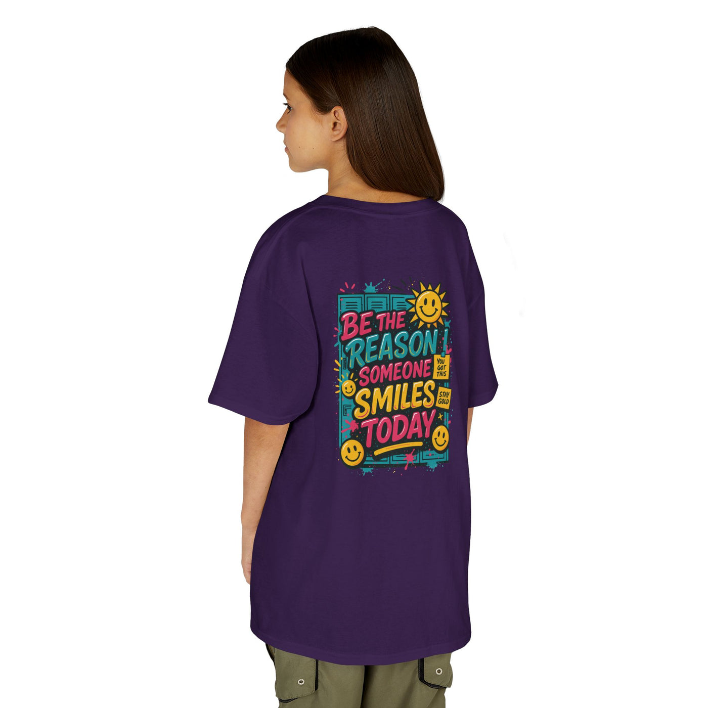 Kids purple tee featuring 'Be The Reason Someone Smiles Today' graphic for motivational back-to-school wear.