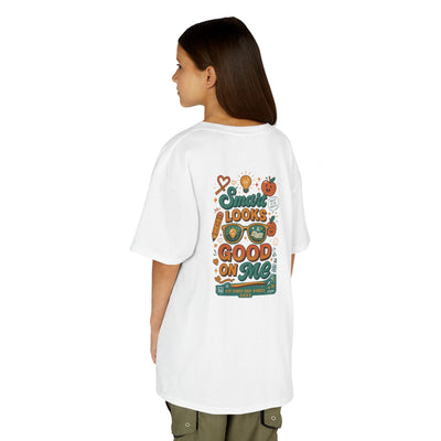 Back view of a kid in a white t-shirt with 'Smart Looks Good On Me' design, perfect for back-to-school style.