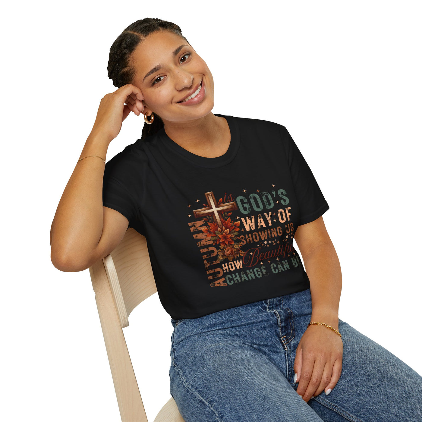 Woman wearing a black tee with fall-inspired design and faith-based message about change.