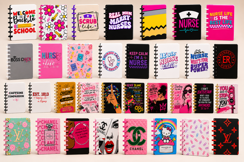 A grid of small spiral-bound notebooks or journal covers displayed on a light background. Each cover features a different colorful graphic design, text slogan, or brand-inspired print, including visible references to Chanel, Louis Vuitton, Hello Kitty, and Starbucks.