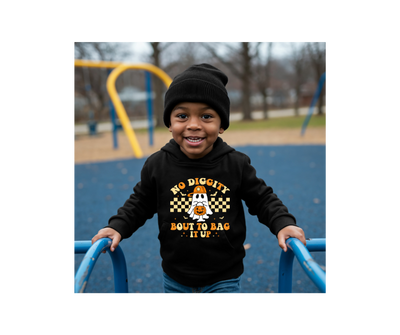 Child wearing a hoodie with text on a playground