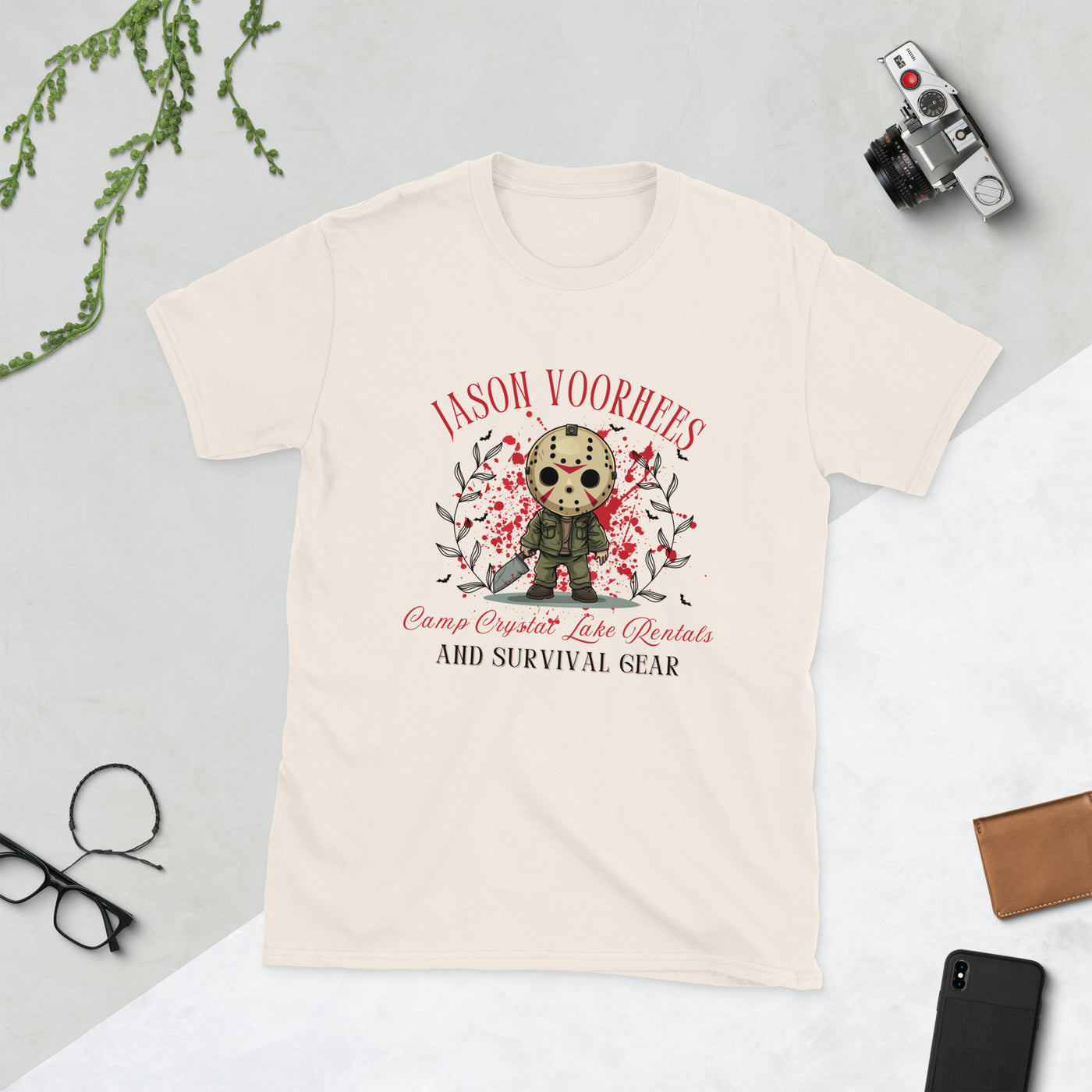 Cream t-shirt featuring Jason Voorhees design with "Camp Crystal Lake Rentals" and spooky graphics.