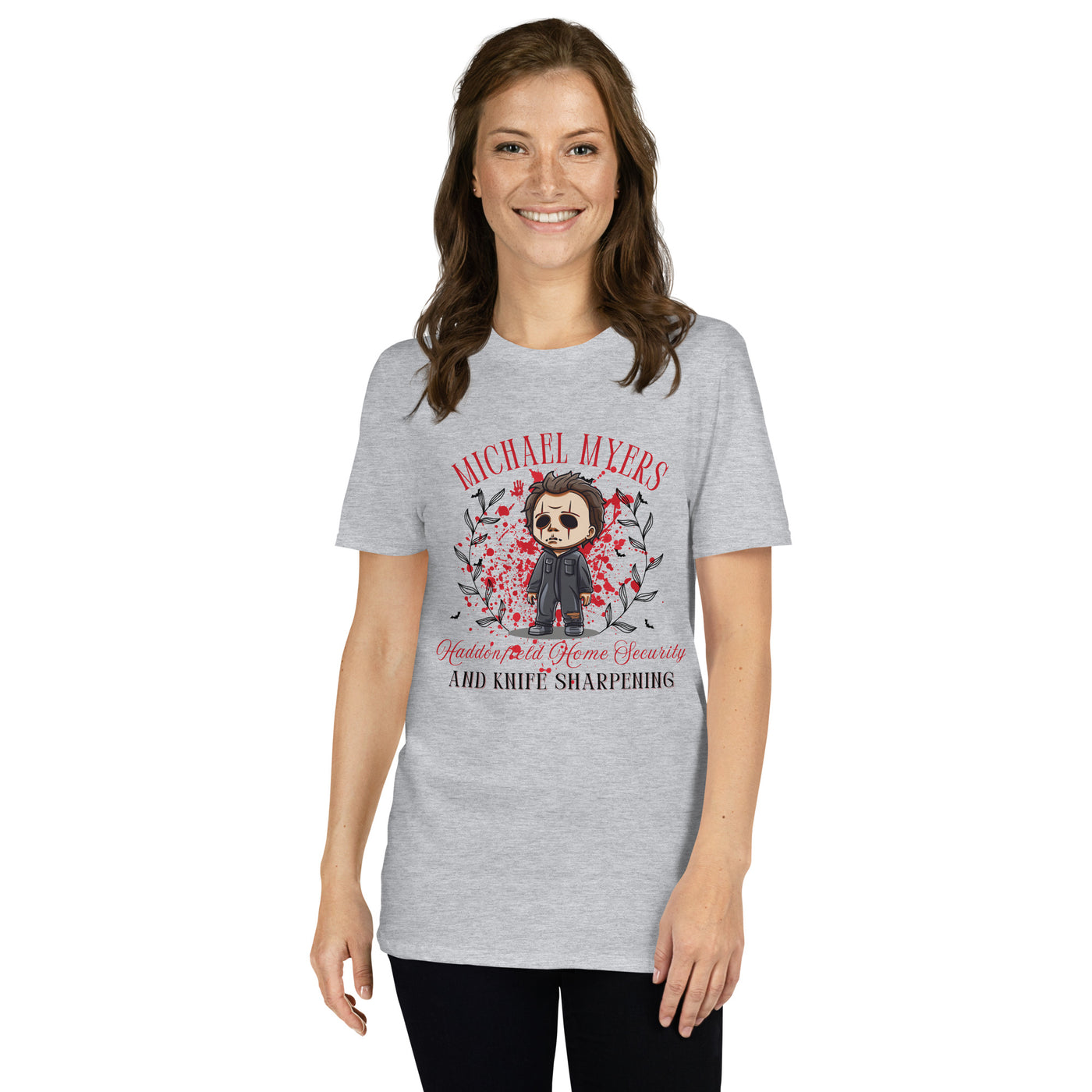 Woman wearing a gray Michael Myers Halloween t-shirt featuring a humorous graphic and fall leaves.