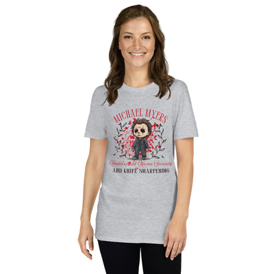 Woman wearing a gray Michael Myers Halloween t-shirt featuring a humorous graphic and fall leaves.